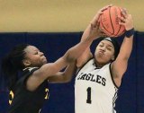 West Hills Lemoore's Janae Tolbert fights for a rebound Saturday night against Taft College. The Eagles defeated Taft 47-31/